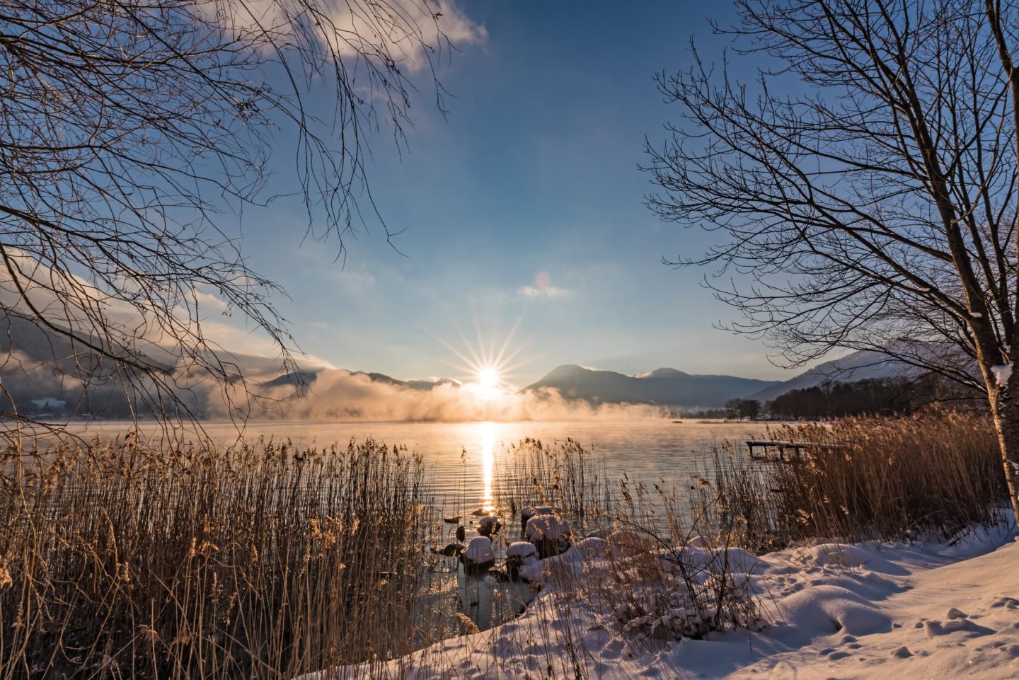 Winterlicher Tegernsee Sonnenuntergang Relais Chalet Wilhelmy